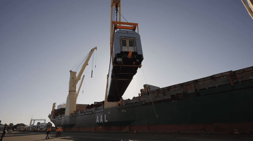 A crane lifting a train car
